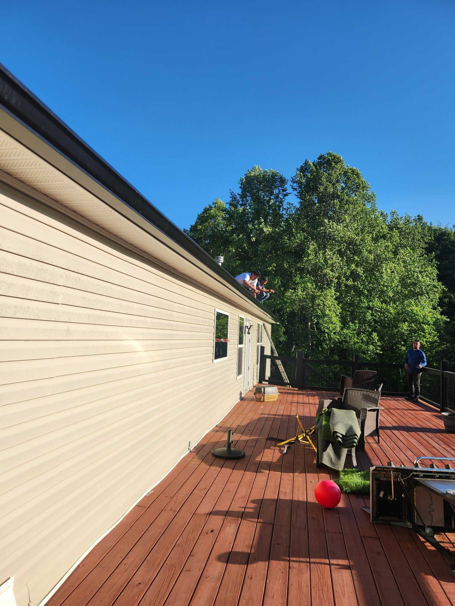 HEP technician at work on the roof with precision
